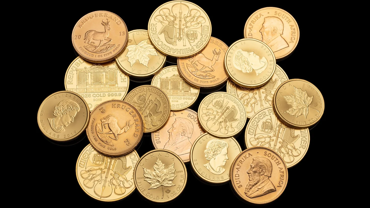 Valeur des pièces d’or : Napoléon 20 F et Krugerrand empilés, à évaluer au poids d’or fin